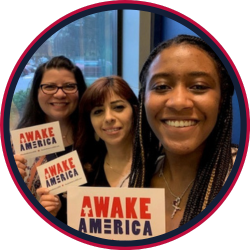 young girls holding AWAKE America prayer cards